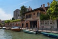 VENICE, ITALY Ã¢â¬â MAY 23, 2017: Traditional narrow canal street with gondolas and old houses in Venice, Italy. Royalty Free Stock Photo